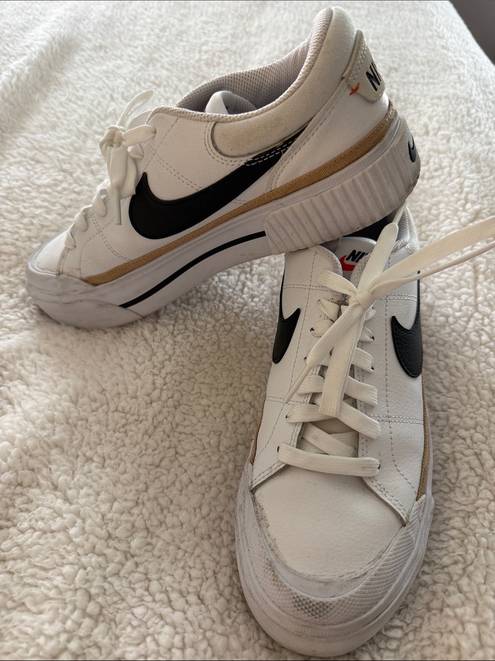 Nike Women’s White Sneakers with Black Swoosh and Gold Trim